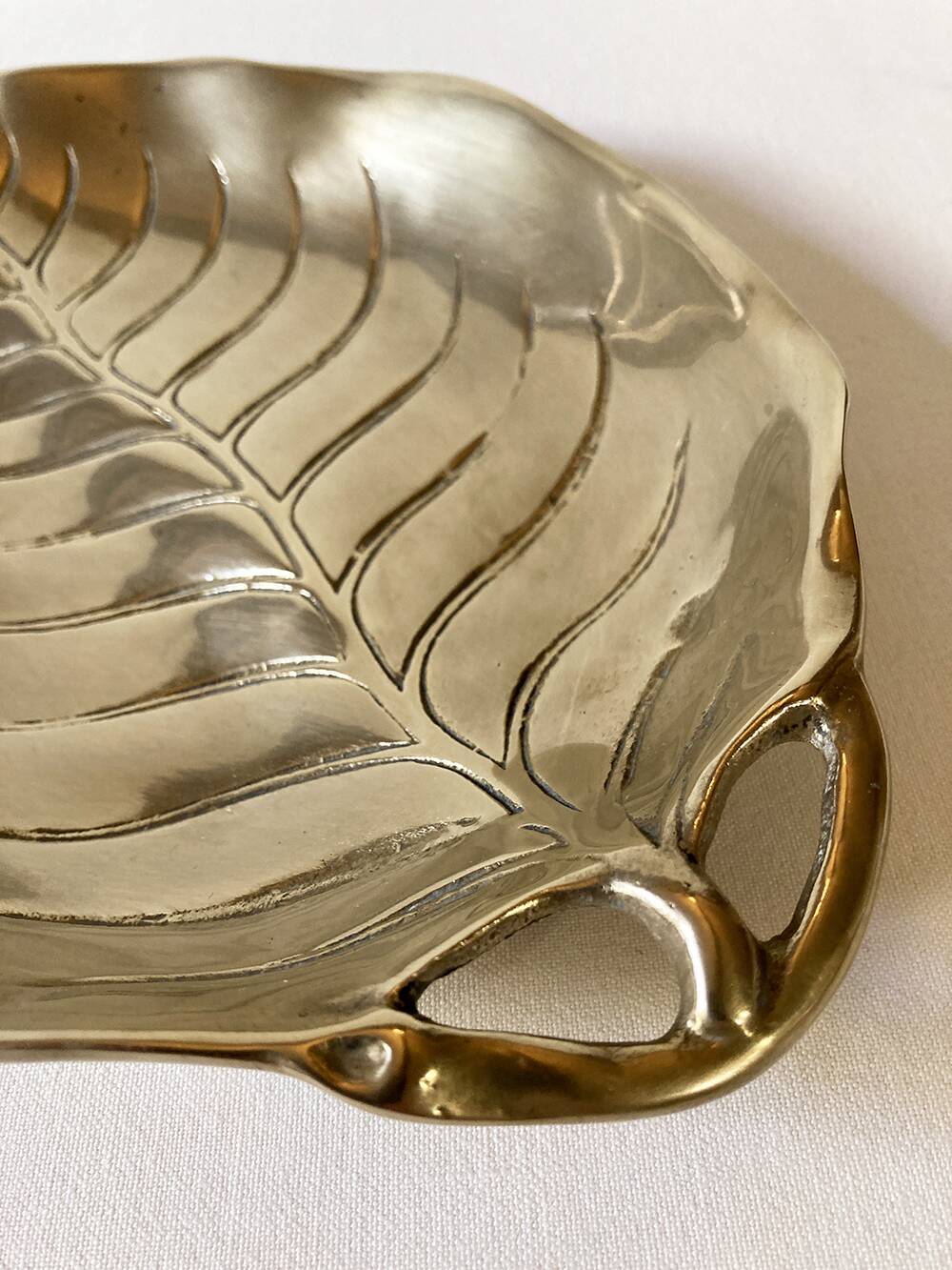 Brass pocket emptier