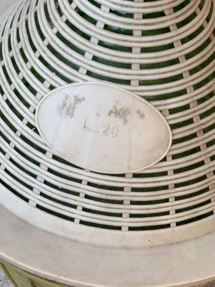 Large green glass lady-Jeanne in a khaki plastic basket, mid-century style.