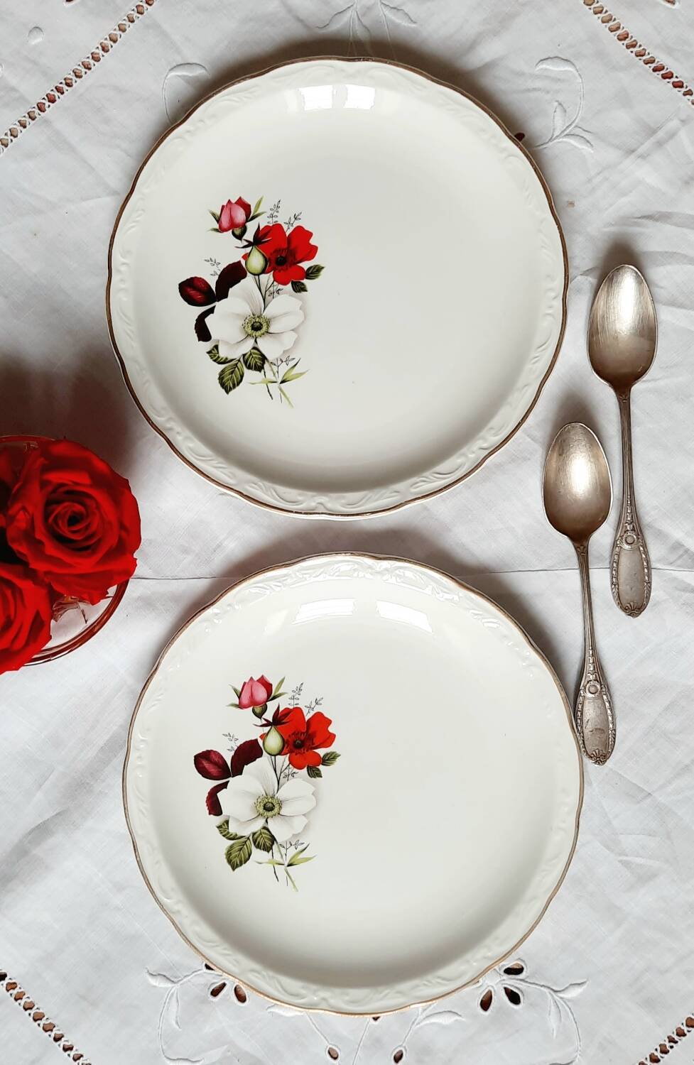 Old mismatched earthenware dessert plates with gold accompanied by a dish