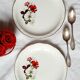 Old mismatched earthenware dessert plates with gold accompanied by a dish