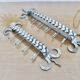 2 Tea towel holders, ironwork in braided raw steel, 1970