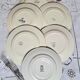 Old mismatched flat plates in iron earth earthenware accompanied by a dish