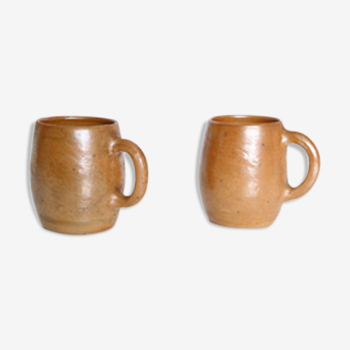 Duo of sandstone mugs