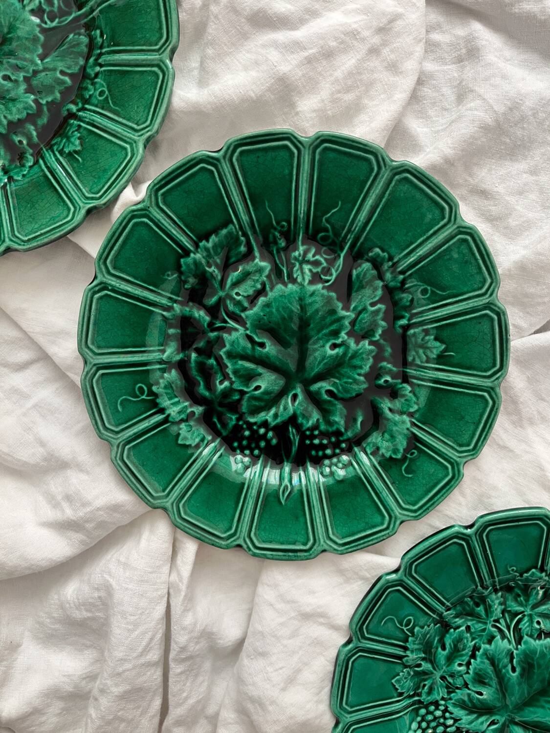 4 old plates in Sarreguemines vine leaf slip