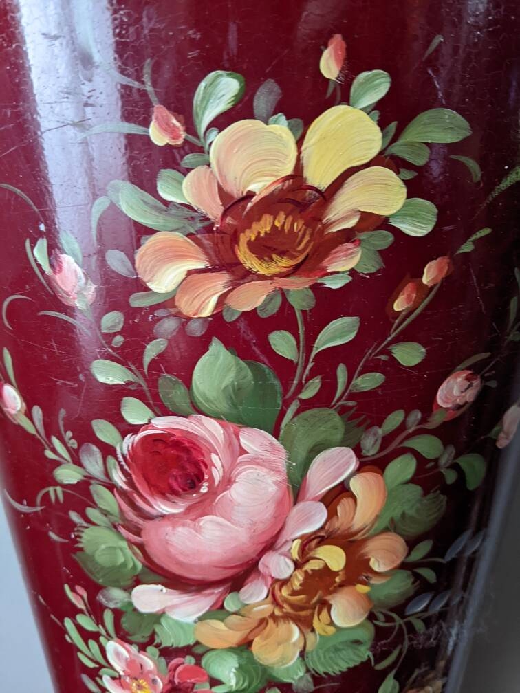 Antique metal umbrella stand with hand-painted floral decor, bohemian countryside