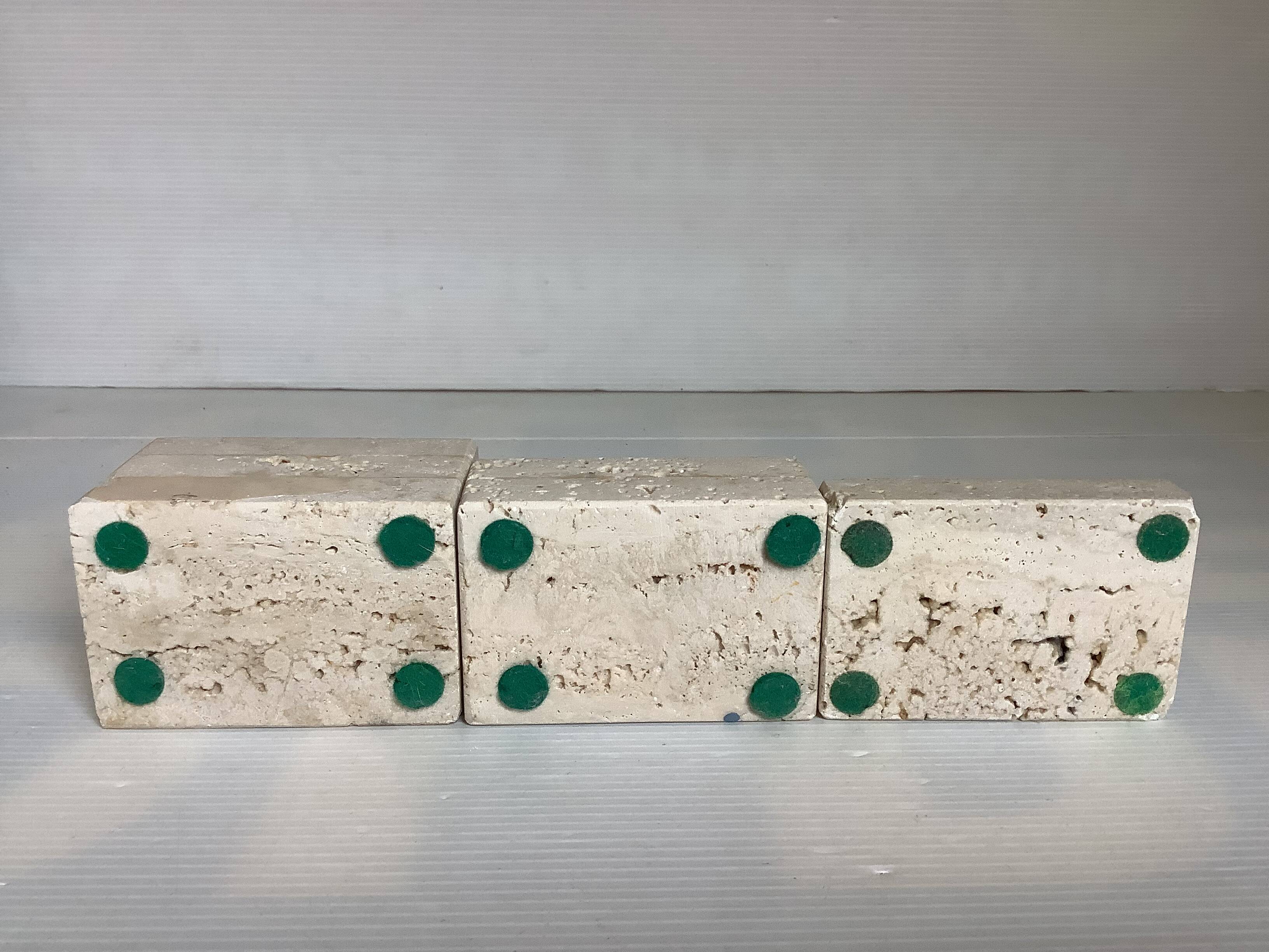 Trio of travertine candlesticks