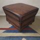 Vintage ottoman / pouffe in chestnut brown leather