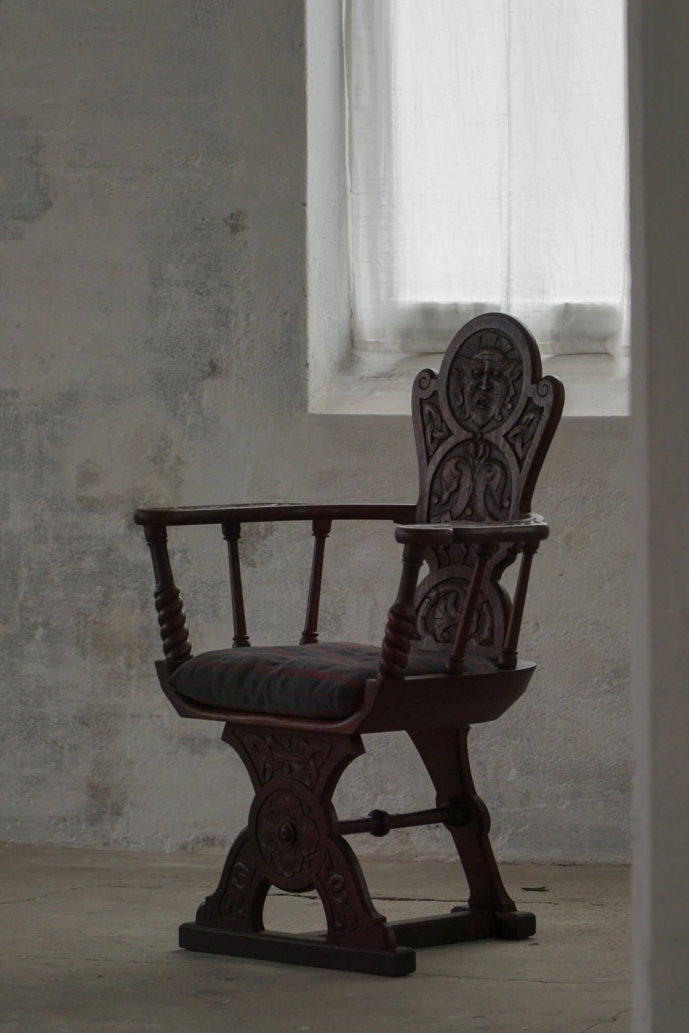 Scandinavian armchair in solid oak with cushion, folk art, early 19th century.