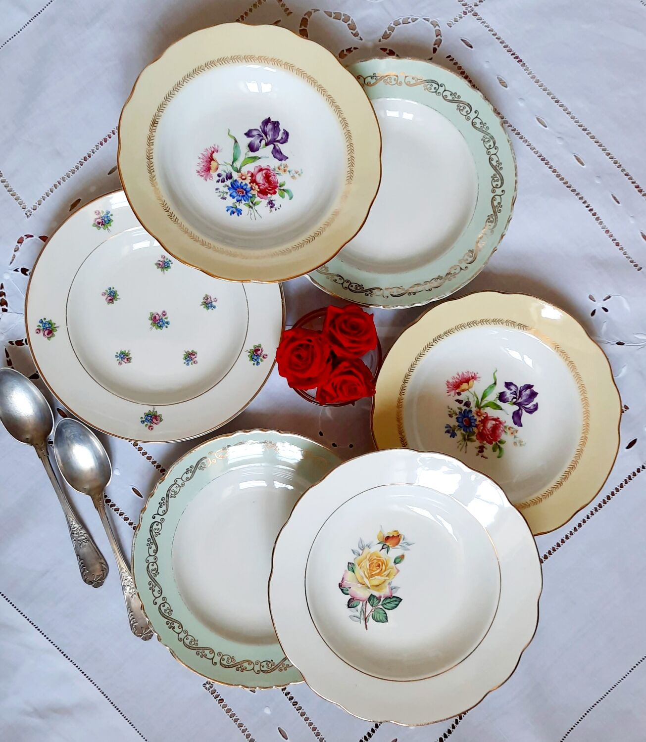 Old hollow plates mismatched in earthenware with gilded edges