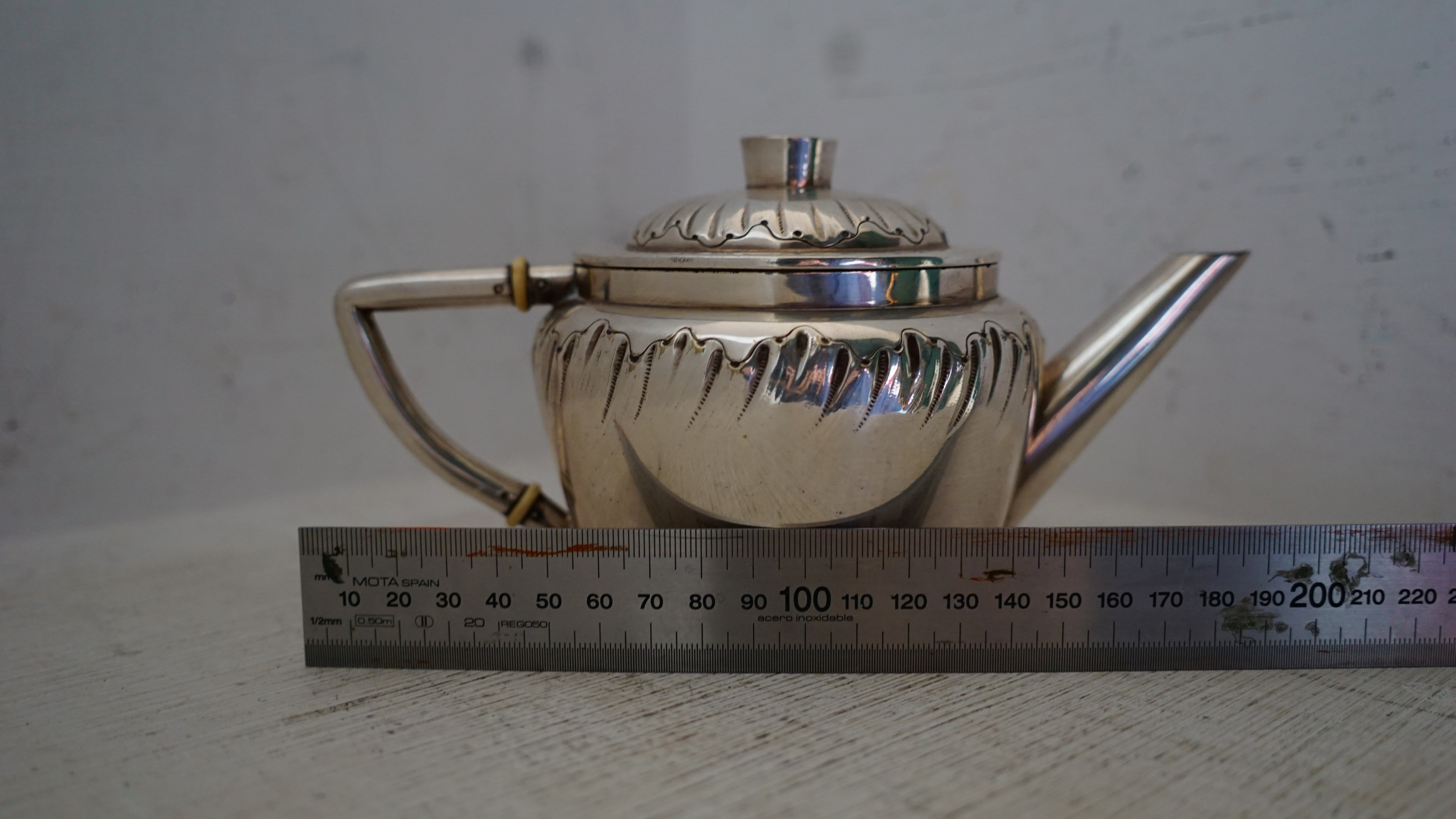 Teapot and milk jug English silverware