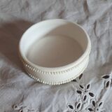 Small round box topped with a vintage biscuit porcelain angel