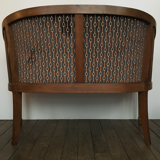 Old wooden and velvet bench