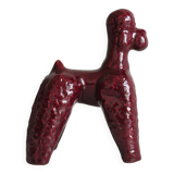 Chien en céramique émaillée rouge.