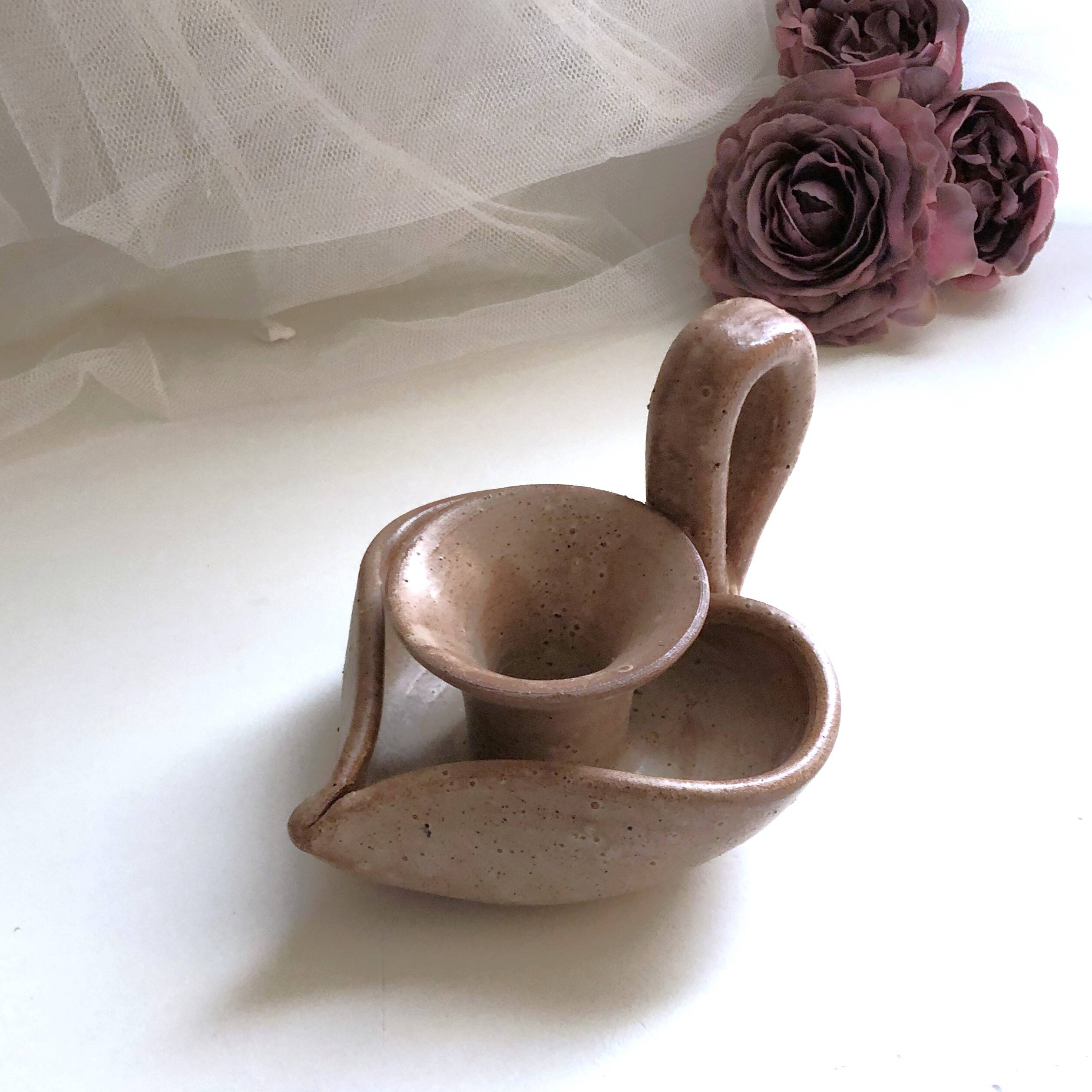 Glazed stoneware heart-shaped hand candle holder