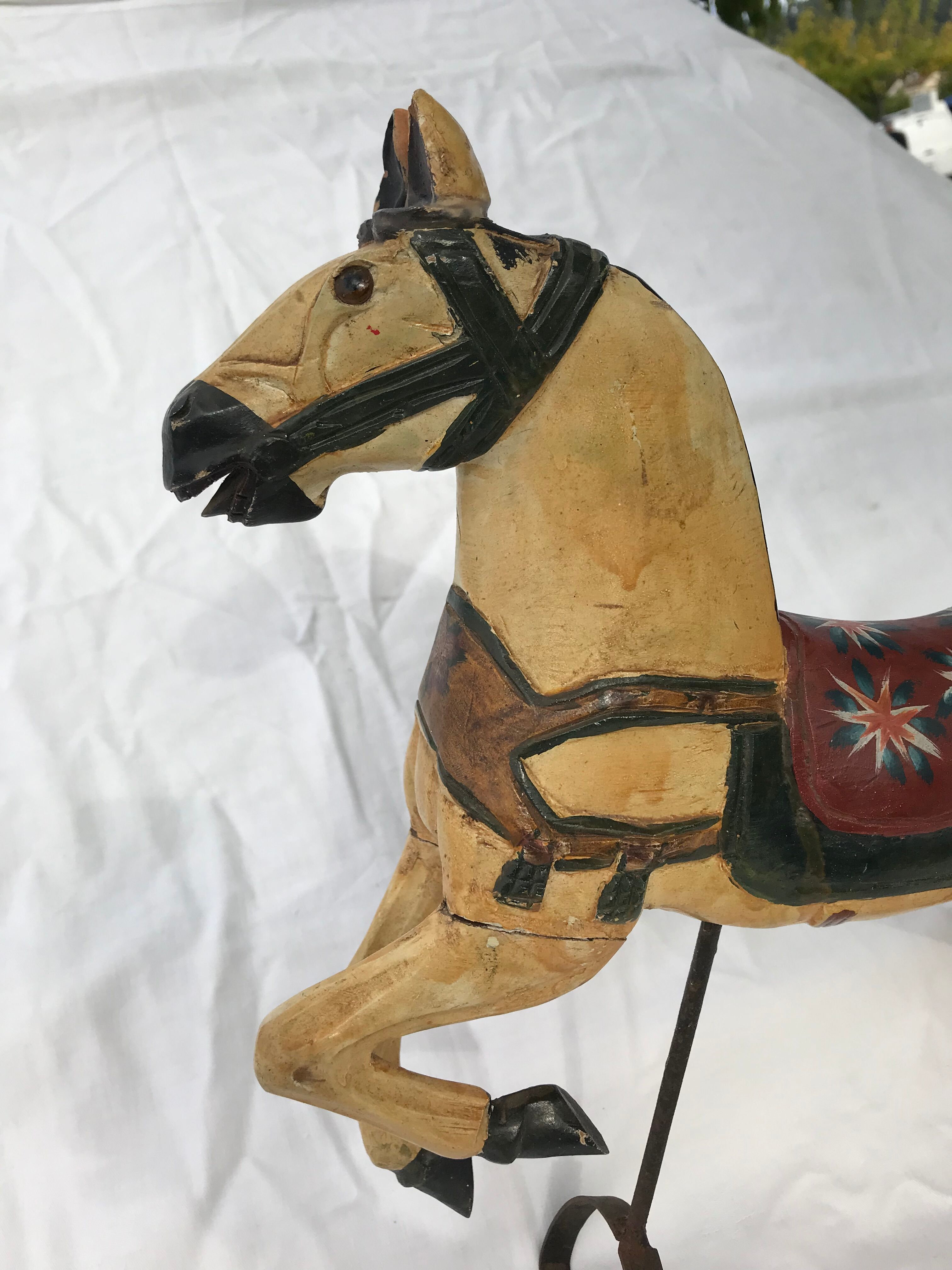 Wooden horse with period ironwork support