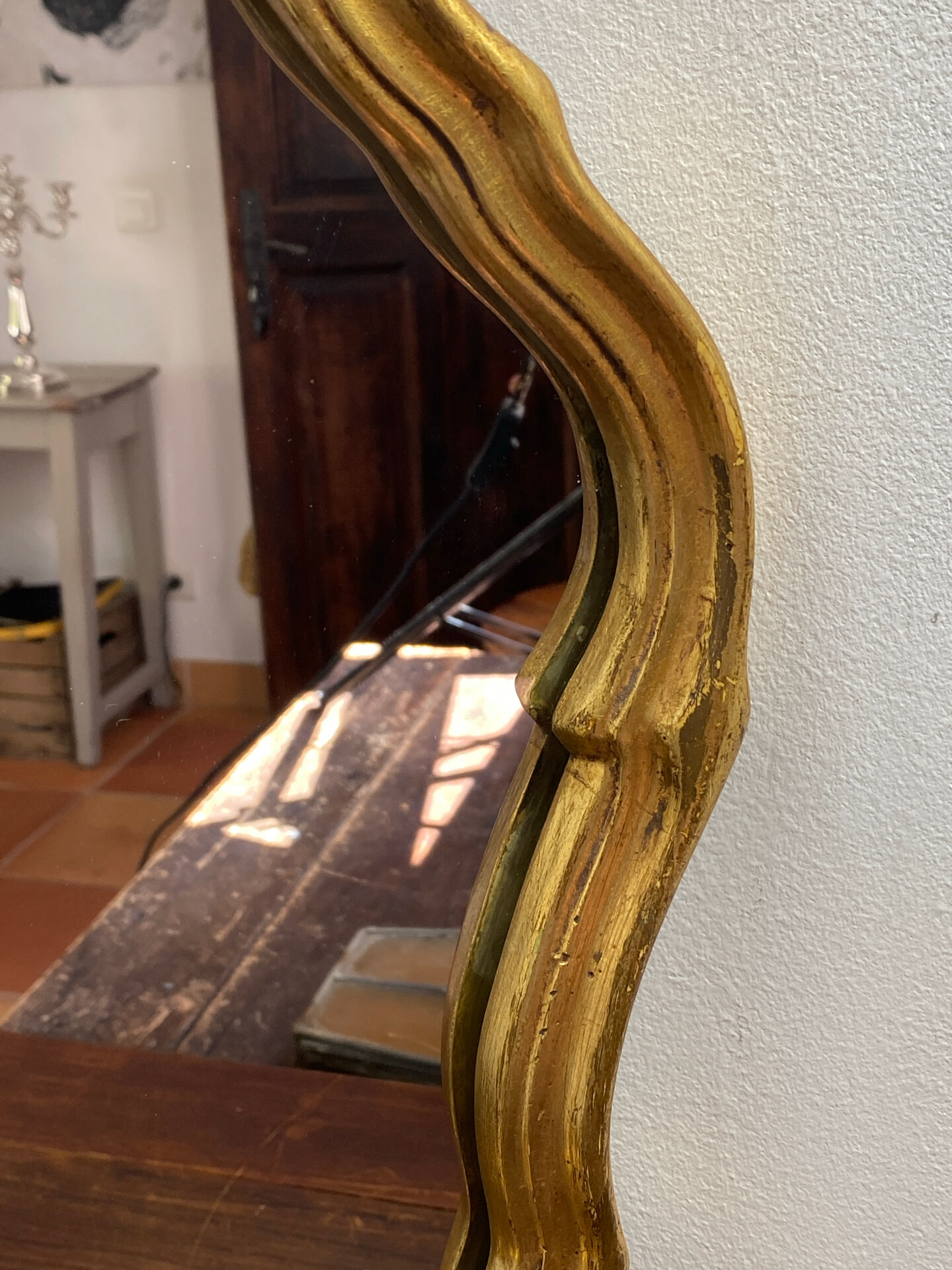 Large baroque mirror in gilded wood