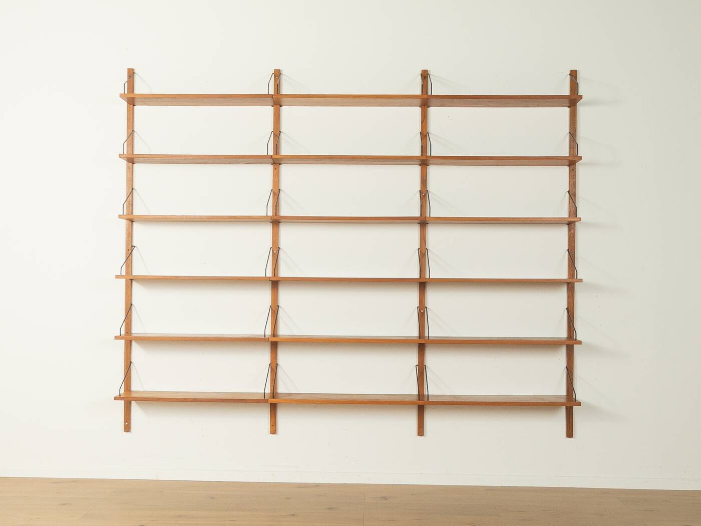 Classic wall shelf by Poul Cadovius for Cado, 1950s, teak veneer, 18 shelves, 4 ladders, Denmark