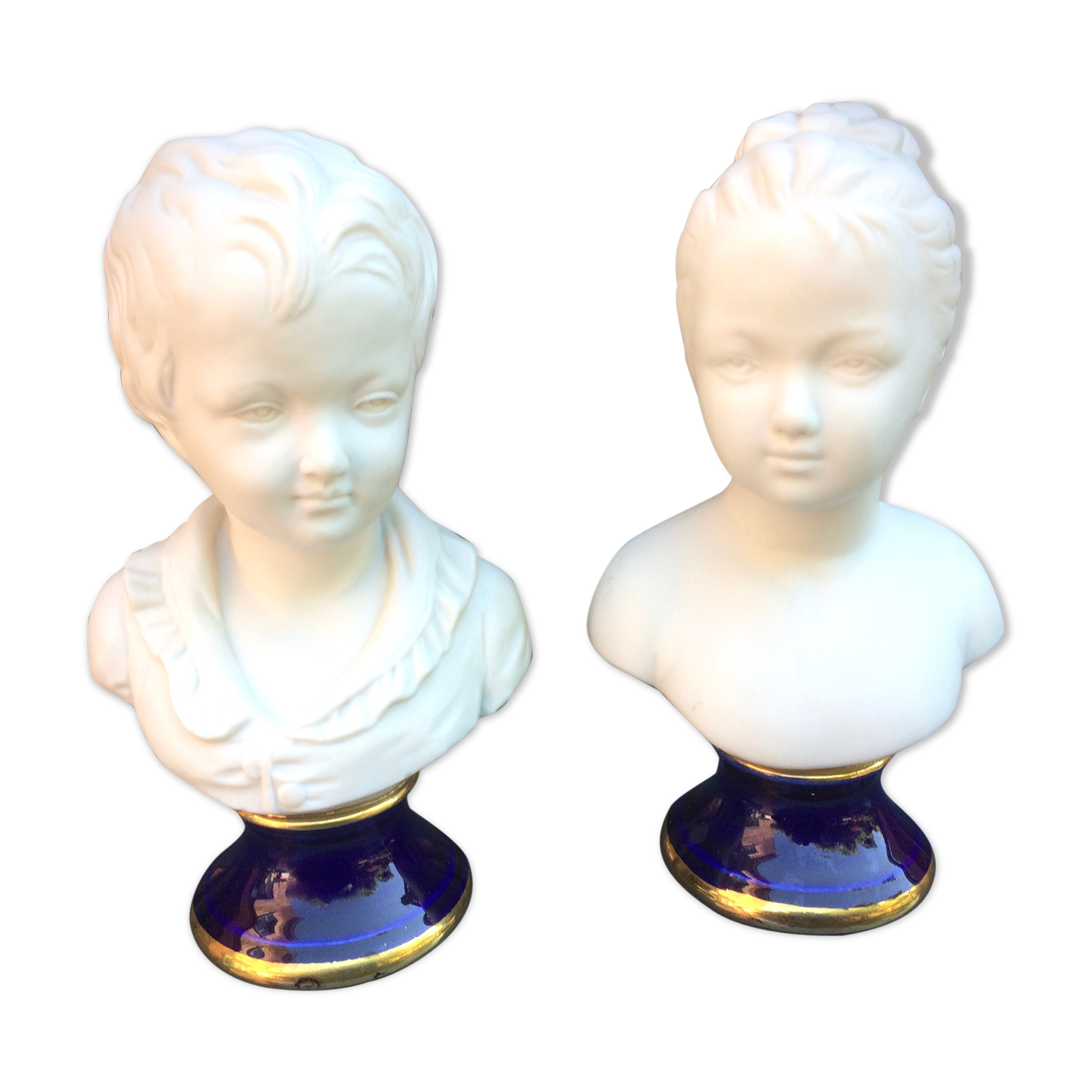 Children's busts in biscuit