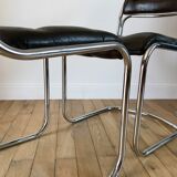 ensemble composé d'une table en chrome et verre fumé et ses 4 chaises tubulaires en chrome et skaï a