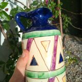 Vintage ceramic pitcher with geometric patterns