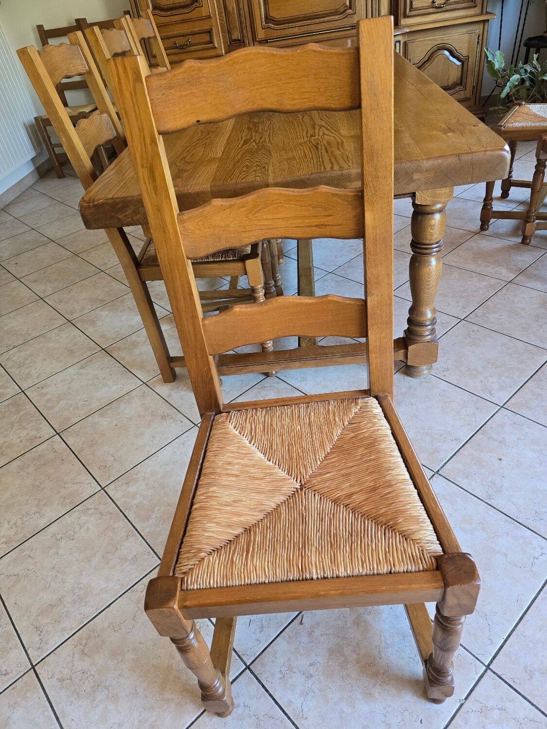 Dining table in solid oak with chairs.