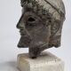 Head of Zeus in patinated plaster in imitation of bronze, 15 cm