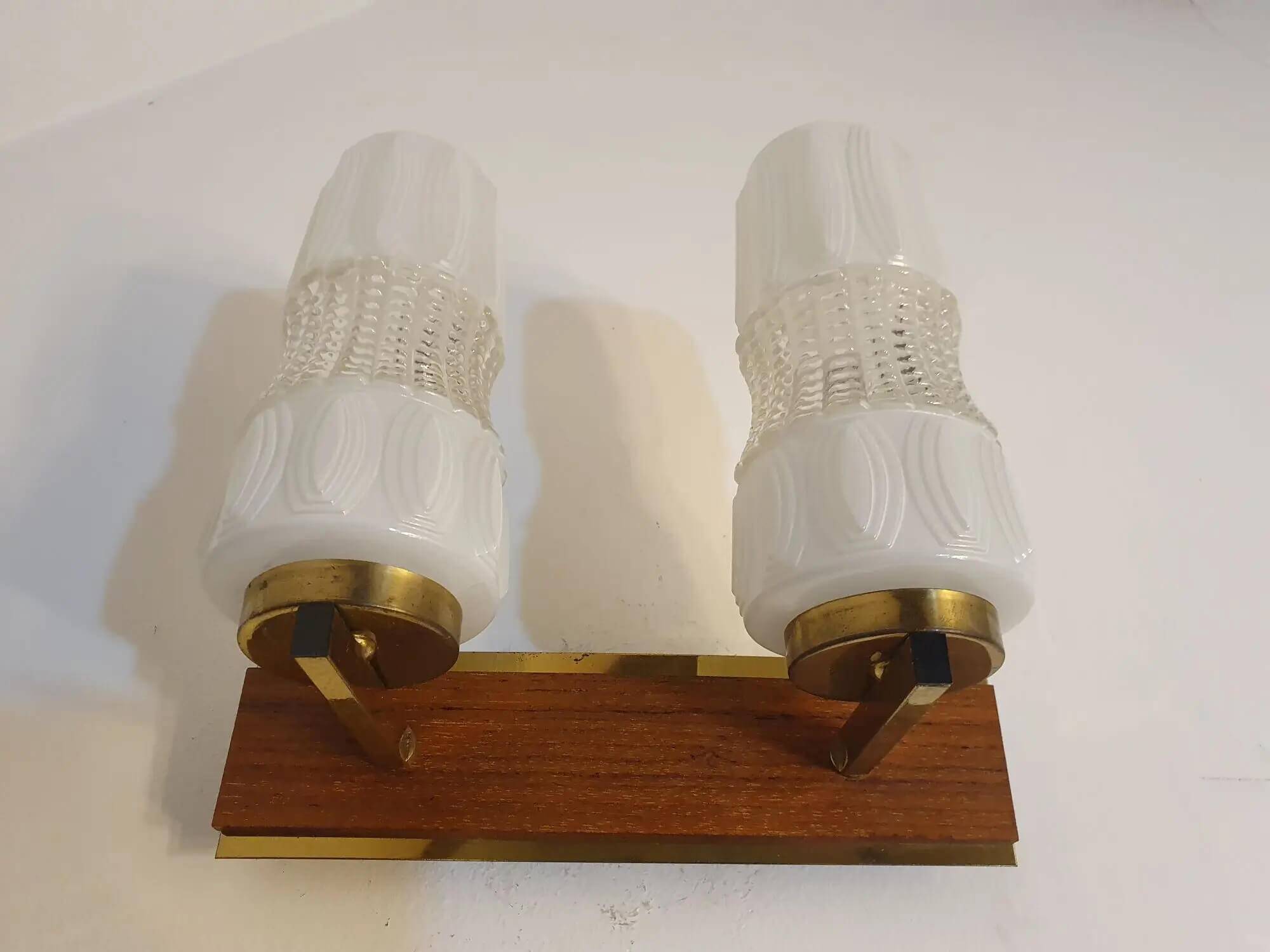 Vintage gold wall light on wooden stand