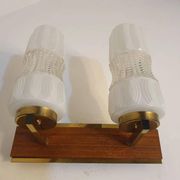 Vintage gold wall light on wooden stand