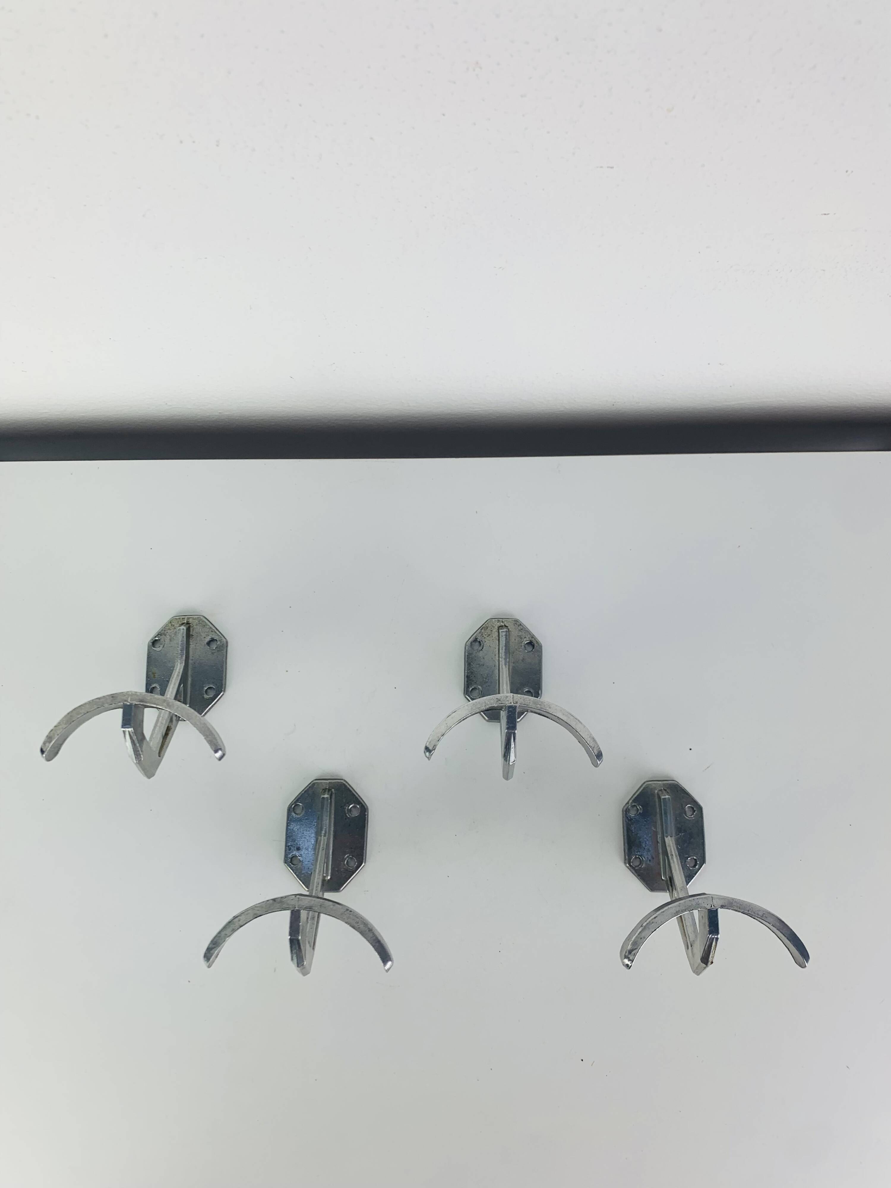 4 wall hooks in aluminium, 1950s