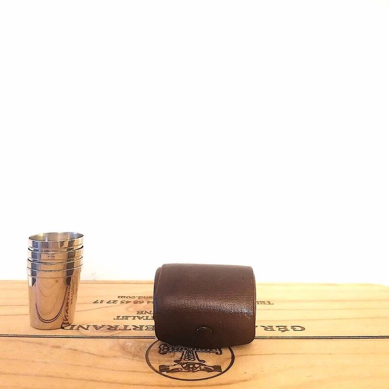 Liquor service in its leather case