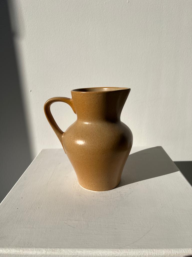 Small pitcher in light beige sandstone