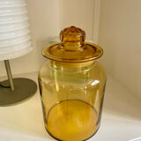 Old apothecary jar in blown amber glass