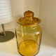 Old apothecary jar in blown amber glass