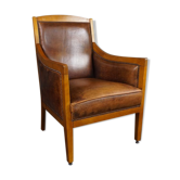 Sheepskin armchair with beautiful light wood.