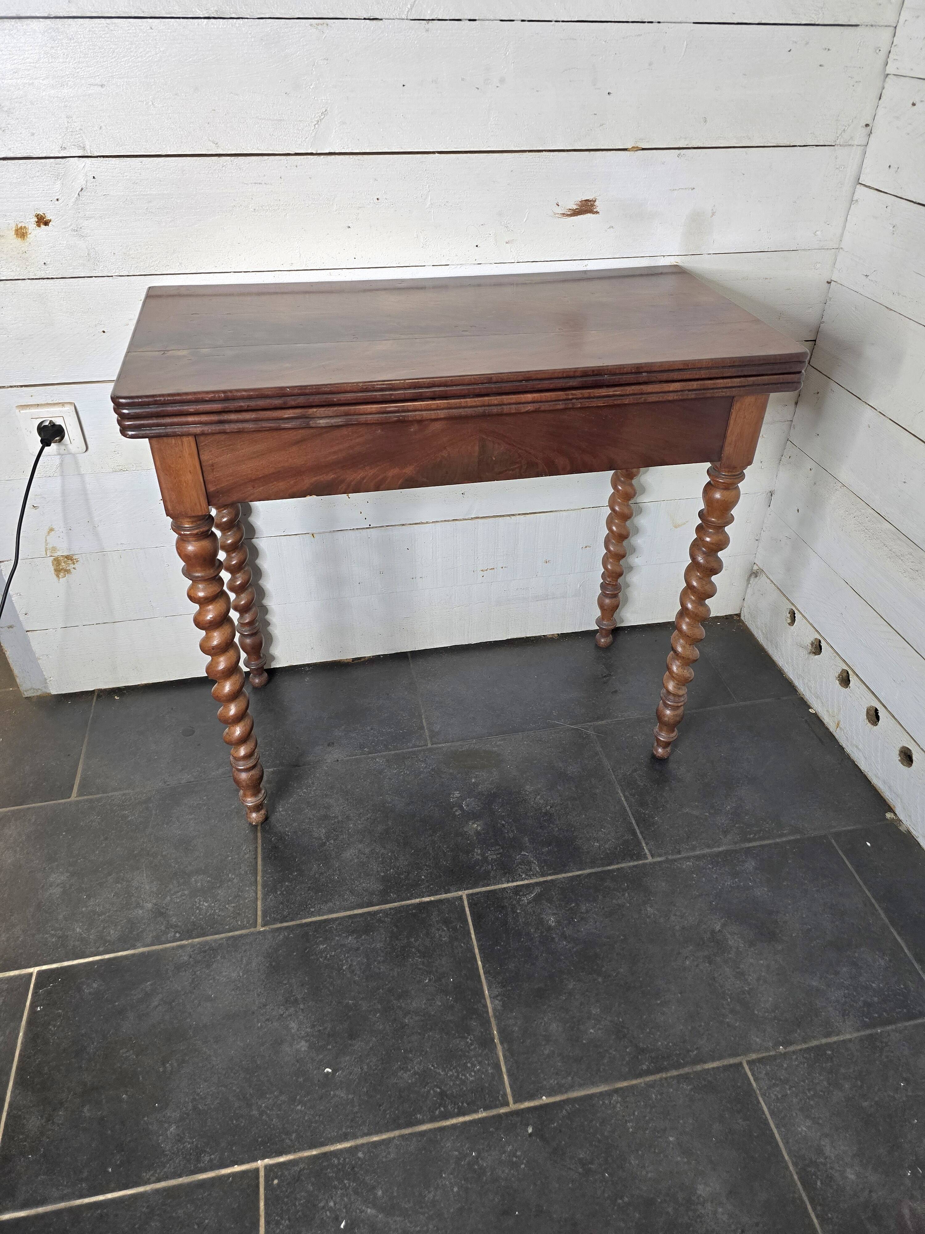 Old mahogany game table