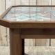 Art Deco side table in mahogany and top covered with a fabric under glass plate