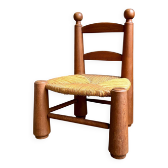 Brutalist low chair in dark wood and straw no. 3