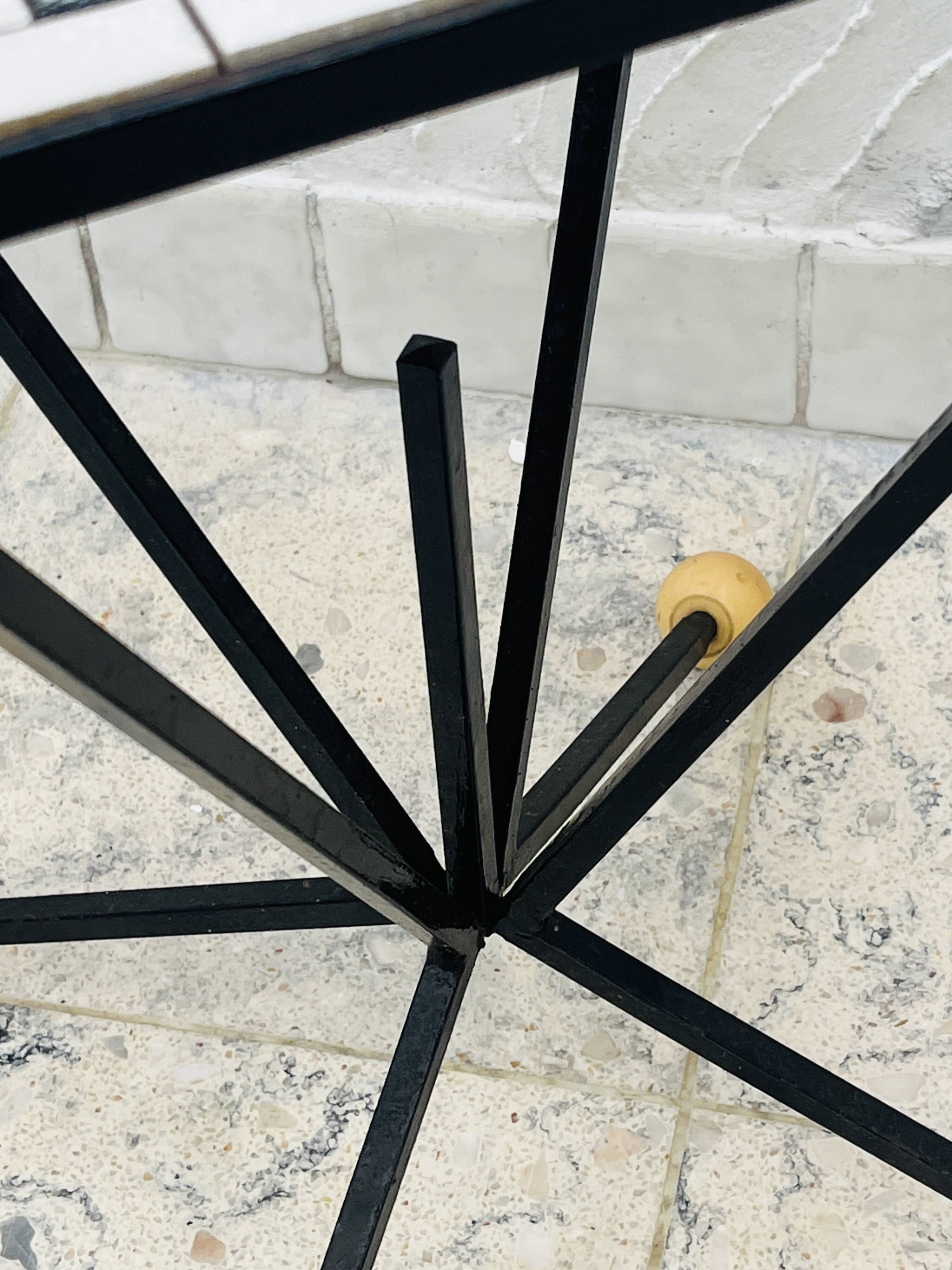Wrought iron stela and black and white tiled top from the 1960s.