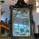 Antique bevelled mirror from the 19th century, sculpted and gilded frame.