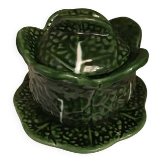 1 small bowl of cabbage with its plate underneath