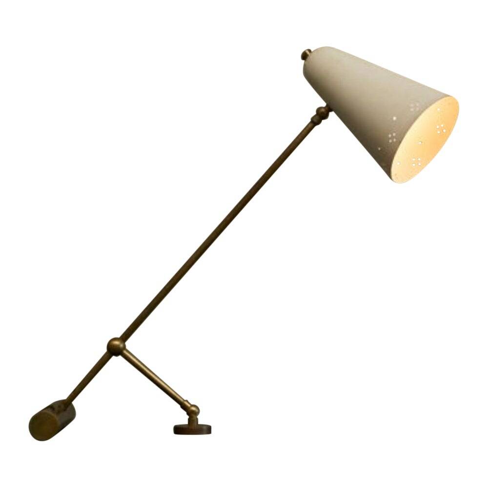 Mid Century adjustable table lamp with perforated shade from the 1950s.