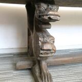 Gothic bench made of solid wood, heads of carved grotesques
