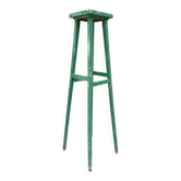 Vintage wooden stool with green patina.