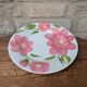 Round serving dish with hand-painted pink flowers in San Marciano ceramic.