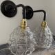 Set of two chiseled glass sconces
