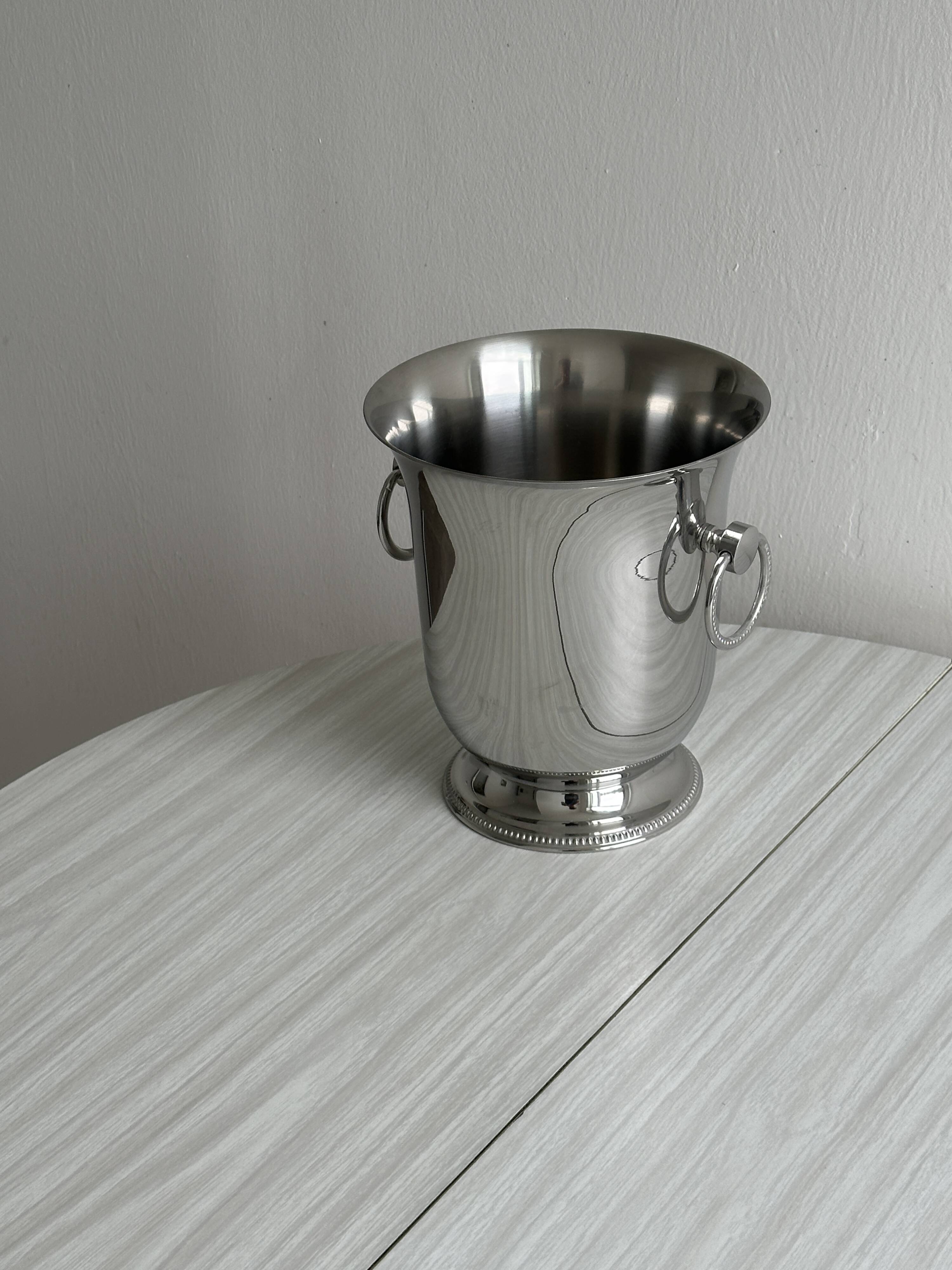 Shiny silver metal champagne bucket