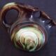 Vase with 3 flowers in the shape of a ceramic snail from Thulin (Belgium)