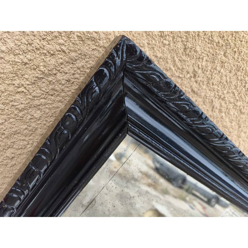 Black lacquered wood mirror "originally punctured"