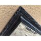 Black lacquered wood mirror "originally punctured"