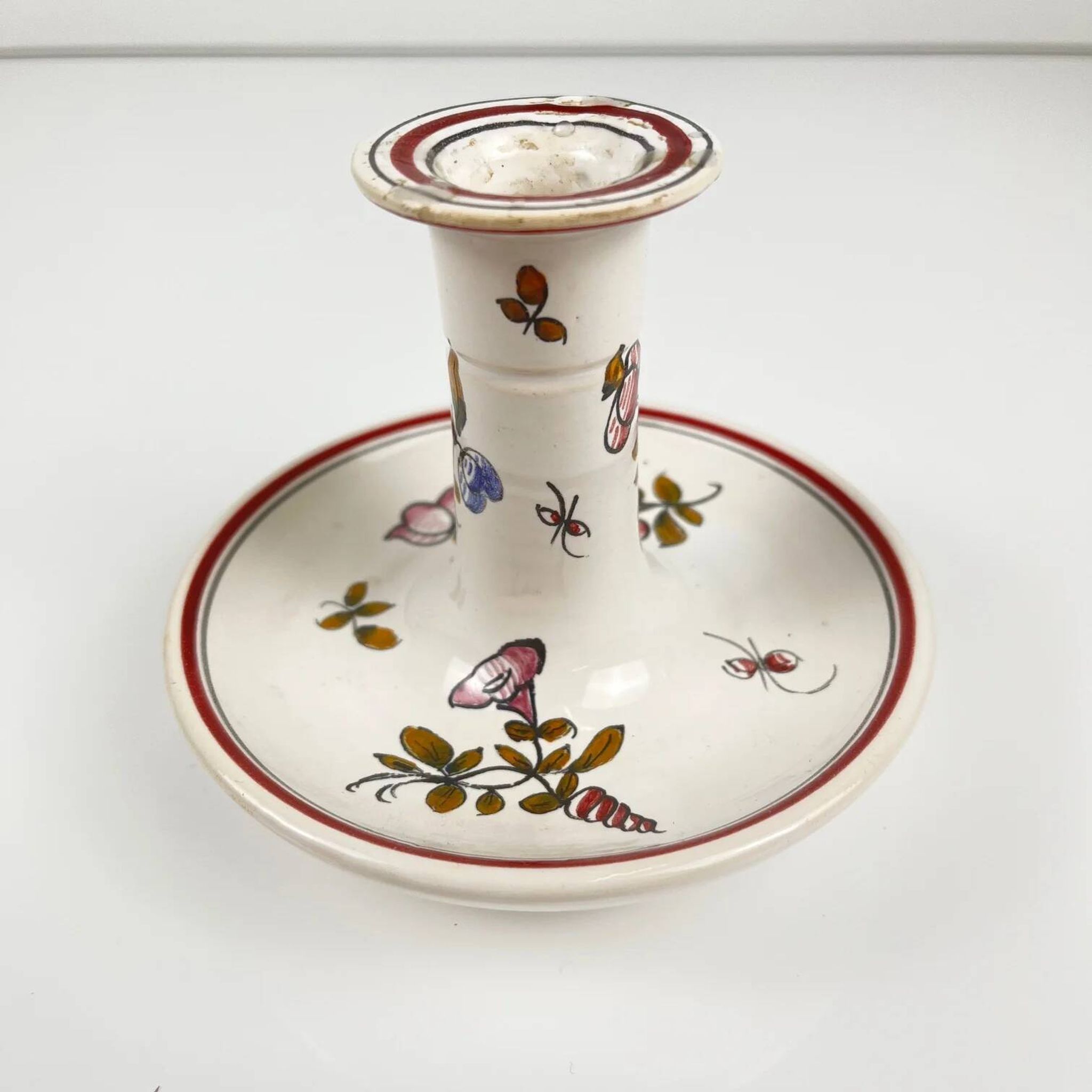 Hand-painted ceramic candlestick, flower pattern.
